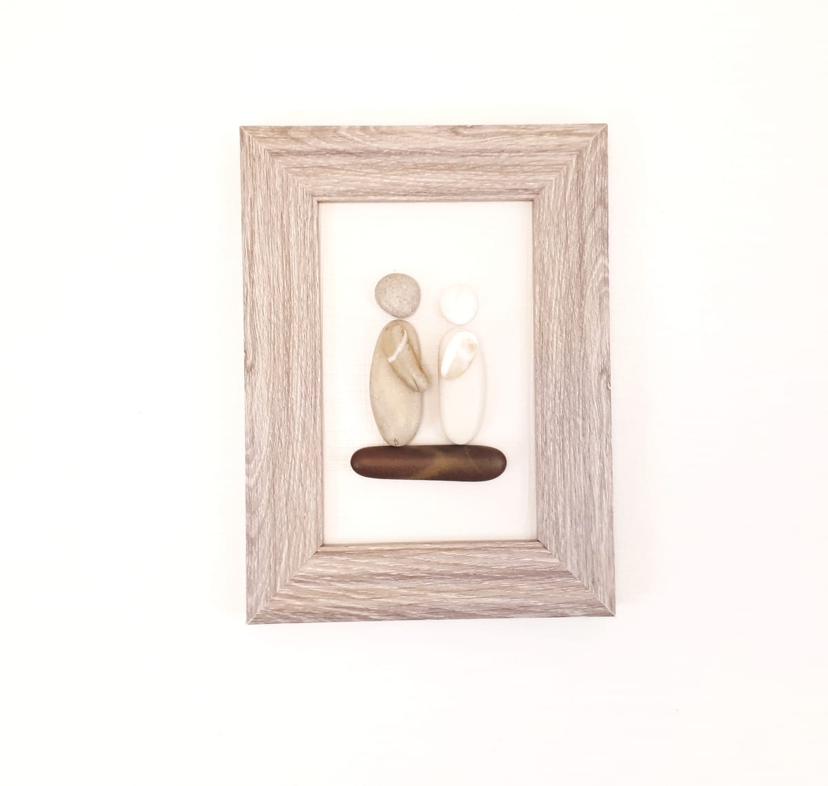 Beach Pebble Frame with Couple facing each other